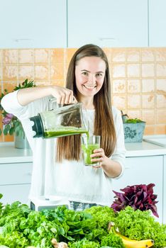 woman is going green healthy shake in blander for breakfast