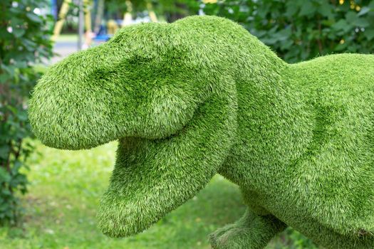 Decorative floral composition statue of dinosaur as artificial plant animal topiary for garden and park decoration