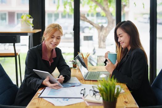 portrait of an Asian businesswoman who is starting to plan a marketing campaign to reach her target audience.