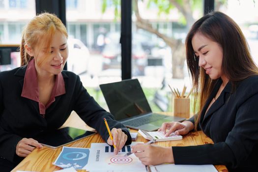 portrait of an Asian businesswoman who is starting to plan a marketing campaign to reach her target audience.