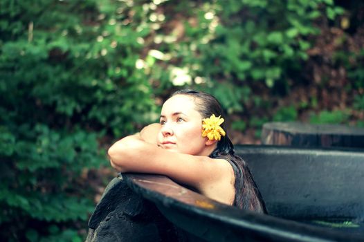 woman enjoying spa in hot tubs outdoors. High quality photo