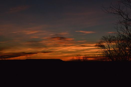 Silhouettes of houses on the background of a picturesque sunset