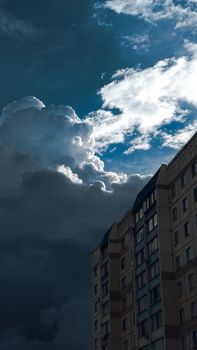 Thick clouds over a multi-storey building