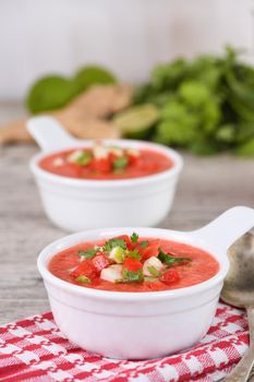 Watermelon tomato gazpacho in bowls. Traditional Spanish cold soup.