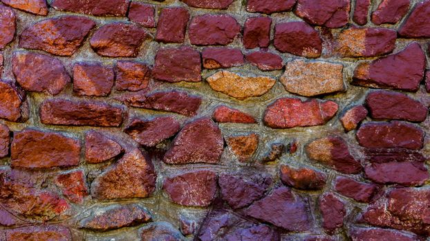Abstract background of a multi-colored stone wall