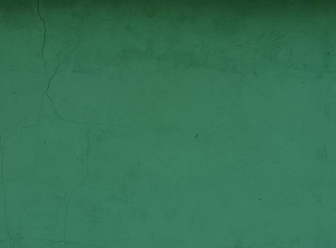 Green Textured Wall Background. Uneven plaster on a wall.