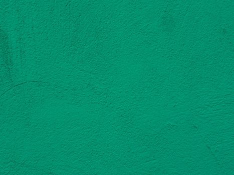 Green Textured Wall Background. Rough surface of green plaster on wall.