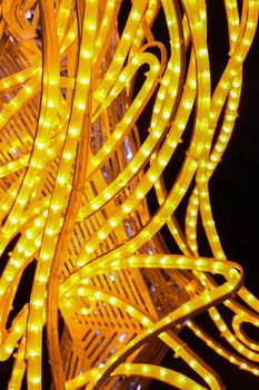 A pattern of yellow LED lamps..Christmas concert. Festive garlands.