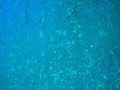 Texture of the plaster.Abstract background old paint. Wall with old shabby blue paint.