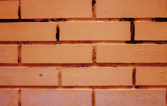 old yellow brick wall texture background.