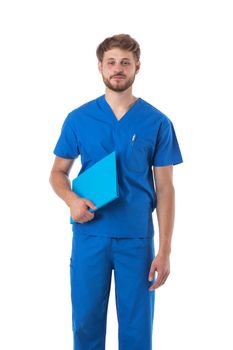 Healthcare, profession and medicine - happy smiling doctor or male nurse in blue uniform with folder isolated on white background