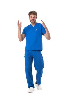 Healthcare, profession and medicine - happy smiling doctor or male nurse in blue uniform dancing isolated on white background