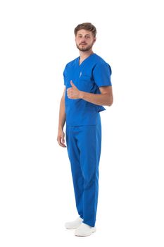 Male nurse or doctor in blue uniform with thumb up studio full length portrait isolated on white background