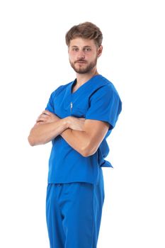 Healthcare, profession and medicine - doctor or male nurse in blue uniform with crossed arms isolated on white background