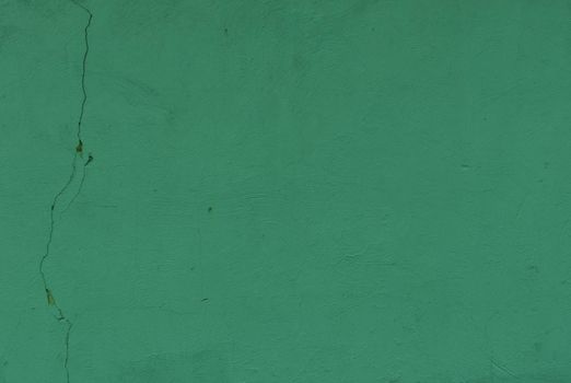 Weather damaged wall. Green Textured Wall Background. Green plaster wall texture.