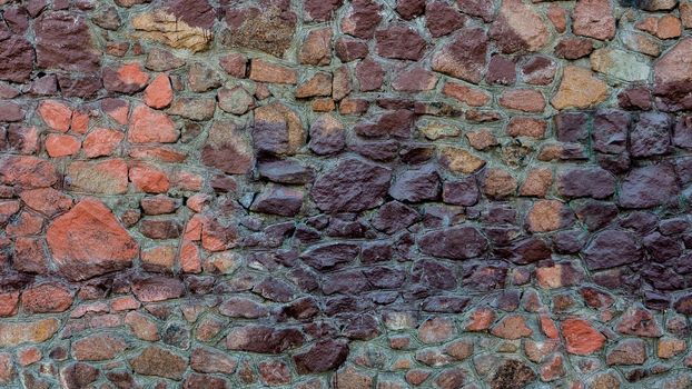 A wall of red, purple stone.