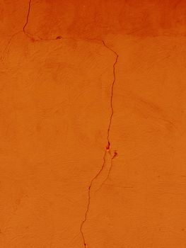 Orange color old grunge wall concrete texture as background...Abstract surface of old roughened orange plaster.