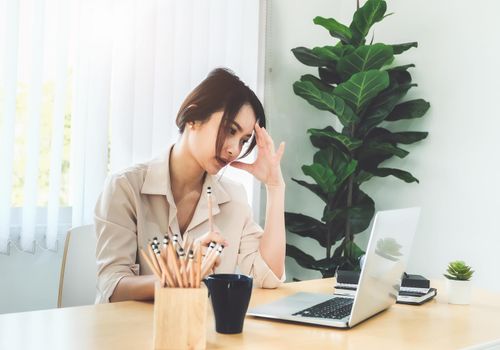 new normal, a businesswoman uses a computer to work for a company Via the internet on your desk at home