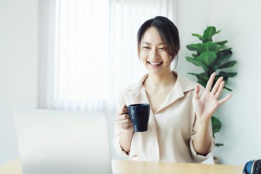 new normal, a businesswoman using computer to work for a company Via the internet on your desk at home