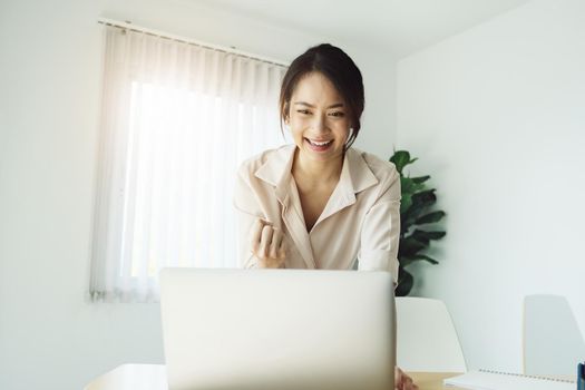 new normal, a businesswoman using computer to work for a company Via the internet on your desk at home