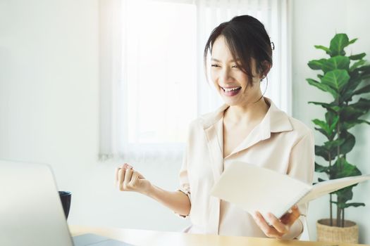 new normal, a businesswoman using computer to work for a company Via the internet on your desk at home