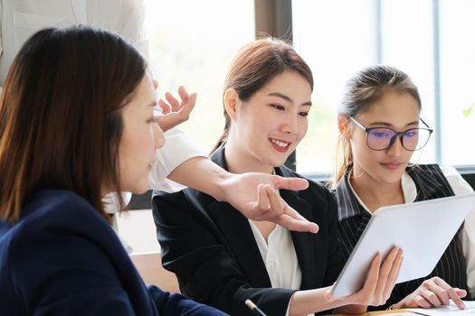 Start-up Business, a team of young entrepreneurs working together to increase profits into the company to increase business potential.