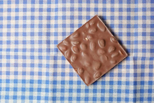 dark chocolate on a plate on table close up .