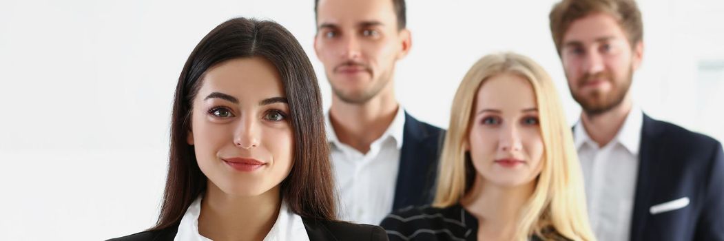 Portrait of confident team of successful people, men and women coworkers pose for collective picture. Employees in trendy suits. Business, teamwork concept