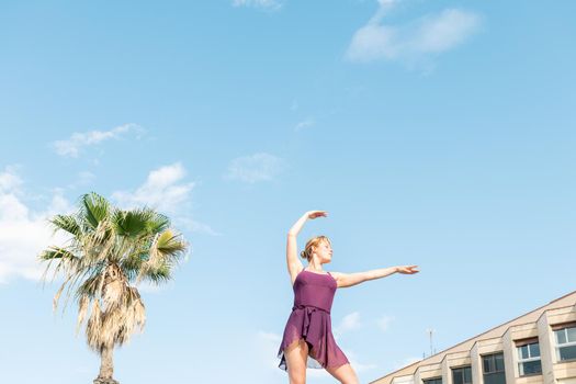 young caucasian classic dancer dancing free in the city, dance and freedom concept, copy space for text