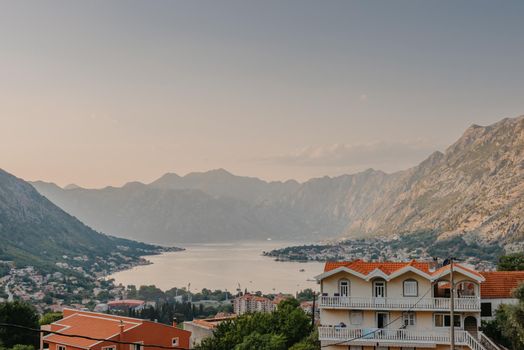 Sunset, beautiful landscape with silhouettes of trees. Travel concept. Montenegro, Kotor Bay. Sunset at Kotor Bay Montenegro. View of the sunset in Boko-Kotor Bay in Montenegro.