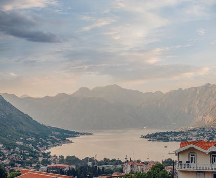 Sunset, beautiful landscape with silhouettes of trees. Travel concept. Montenegro, Kotor Bay. Sunset at Kotor Bay Montenegro. View of the sunset in Boko-Kotor Bay in Montenegro.