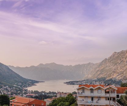 Sunset, beautiful landscape with silhouettes of trees. Travel concept. Montenegro, Kotor Bay. Sunset at Kotor Bay Montenegro. View of the sunset in Boko-Kotor Bay in Montenegro.