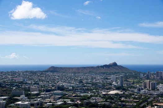 Aerial view of Diamondhead, Kapiolani Park, Waikiki, Ala Wai Canal, Kapahulu town, Pacific ocean, clouds, and Golf Course on Oahu, Hawaii.