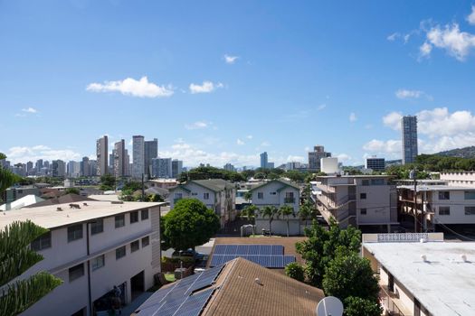 Kapahulu town in Honolulu with homes, condos, and mountain of Tantalus on a clear day on Oahu, Hawaii.