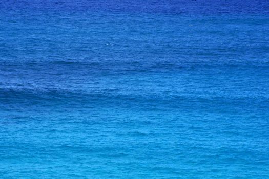 Shades of Blue Ocean Water ripples off the Windward coast of Oahu reflecting light.  Good for backgrounds textures.