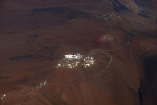 Aerial of Telescopes and roadway on top of Mauna Kea Mountain