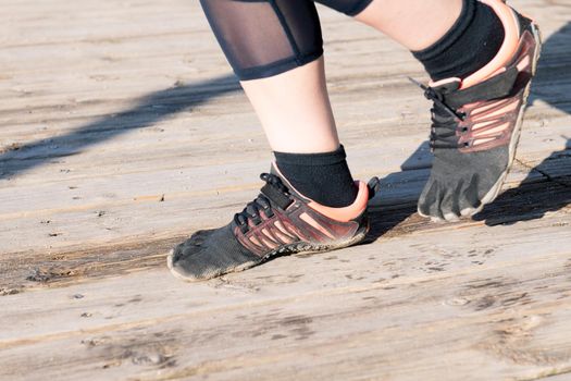 runner feet with five toes running shoes, barefoot sport concept and healthy lifestyle