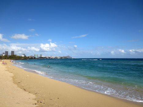 Sand Island Beach with Downtown Honolulu in the distance on Oahu, Hawaii. May 2015.