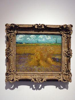 Wheat Field, 1888, Vincent Van Gogh.   Wheat Field belongs to the artist's "Harvest" series, a group of ten paintings from the last half of June 1888. Distinct horizontal compositional bands lead the eye from the sheaves in the foreground to the rows of wheat in the middle ground, to the trees and houses on the horizon and the sky above. 