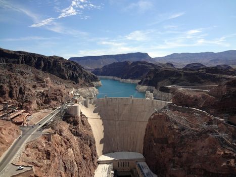 Aerial view of the Colorado River and Hoover Dam and road leading to dam, a snapshot taken from bypass bridge on the border of Arizona and Nevada, USA. July 2011.