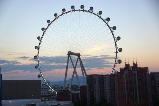 LAS VEGAS - JUNE 27, 2015 - The High Roller Wheel light up at dawn at the center of the Las Vegas Strip on June 27, 2015 in Las Vegas. The High Roller is the world's largest observation wheel.