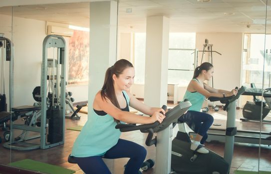 young woman training in the gym. High quality photo