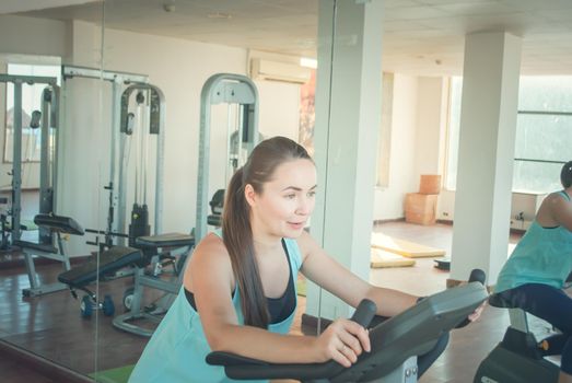 young woman training in the gym. High quality photo