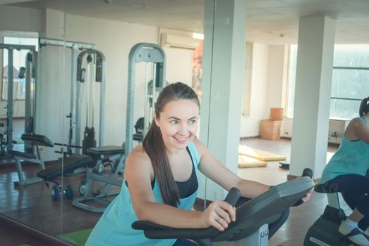 young woman training in the gym. High quality photo