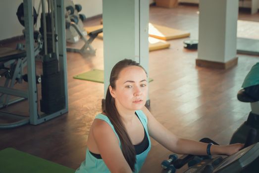 young woman training in the gym. High quality photo