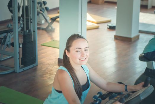 young woman training in the gym. High quality photo