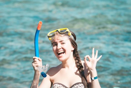 happy smiling young woman wearing mask for diving at the Red Sea