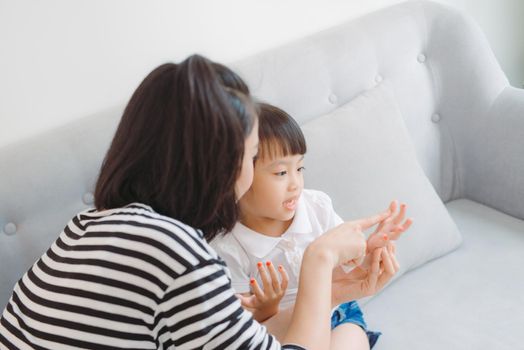 Mother and daughter paint their nails and have fun