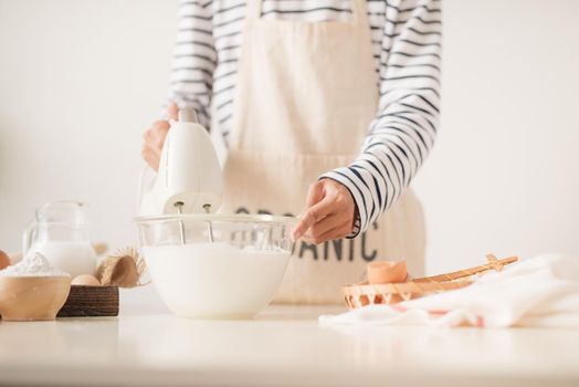 Kitchen mixer whipped cream custard pastry whisk rotates rapidly