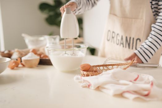 Kitchen mixer whipped cream custard pastry whisk rotates rapidly